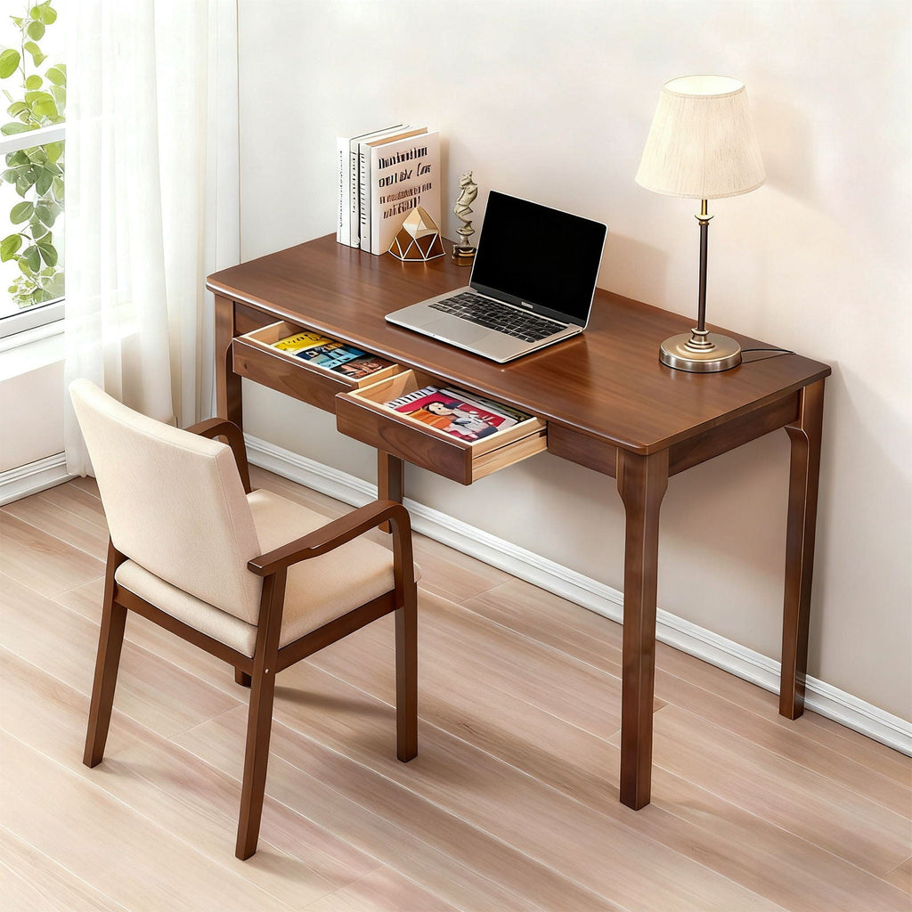 Walnut desk styled with a laptop, with drawers open showing interior storage